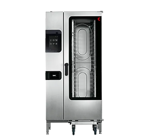 Interior of a commercial combi oven being cleaned with chemical spray and cloth