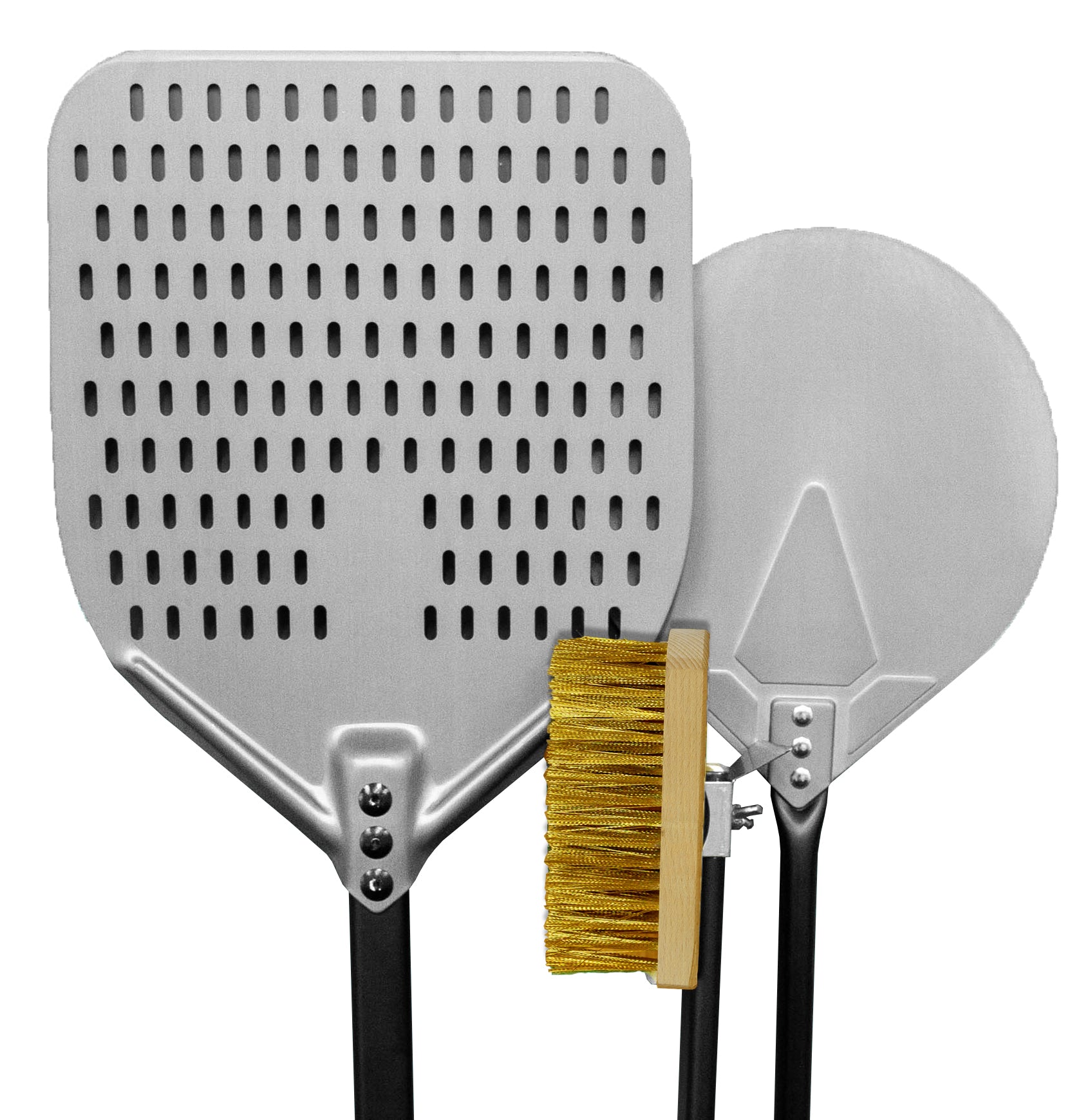 Pizza oven tools including a long-handle peel, brush, and scraper laid next to a wood-fired oven