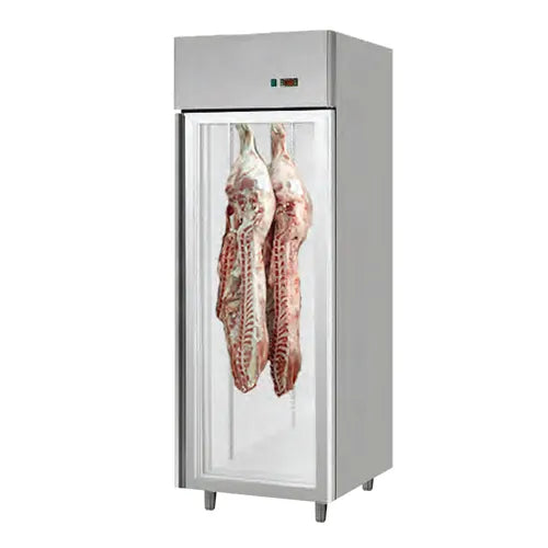 Dry-aging cabinet with meat hanging inside at controlled temperature and humidity