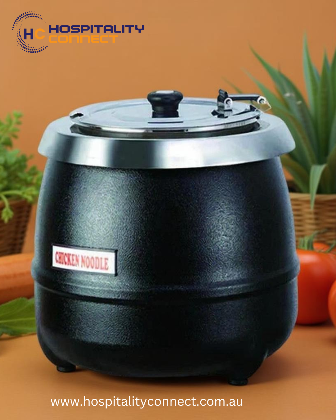 Large stainless steel soup kettle keeping soup hot and ready for service in a commercial kitchen