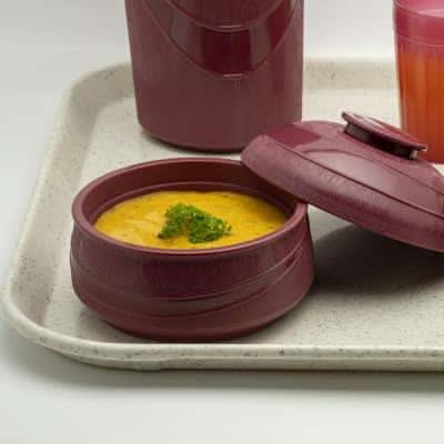 KH Healthcare insulated burgundy soup bowl in PP/PU material, shown in a lifestyle setting.