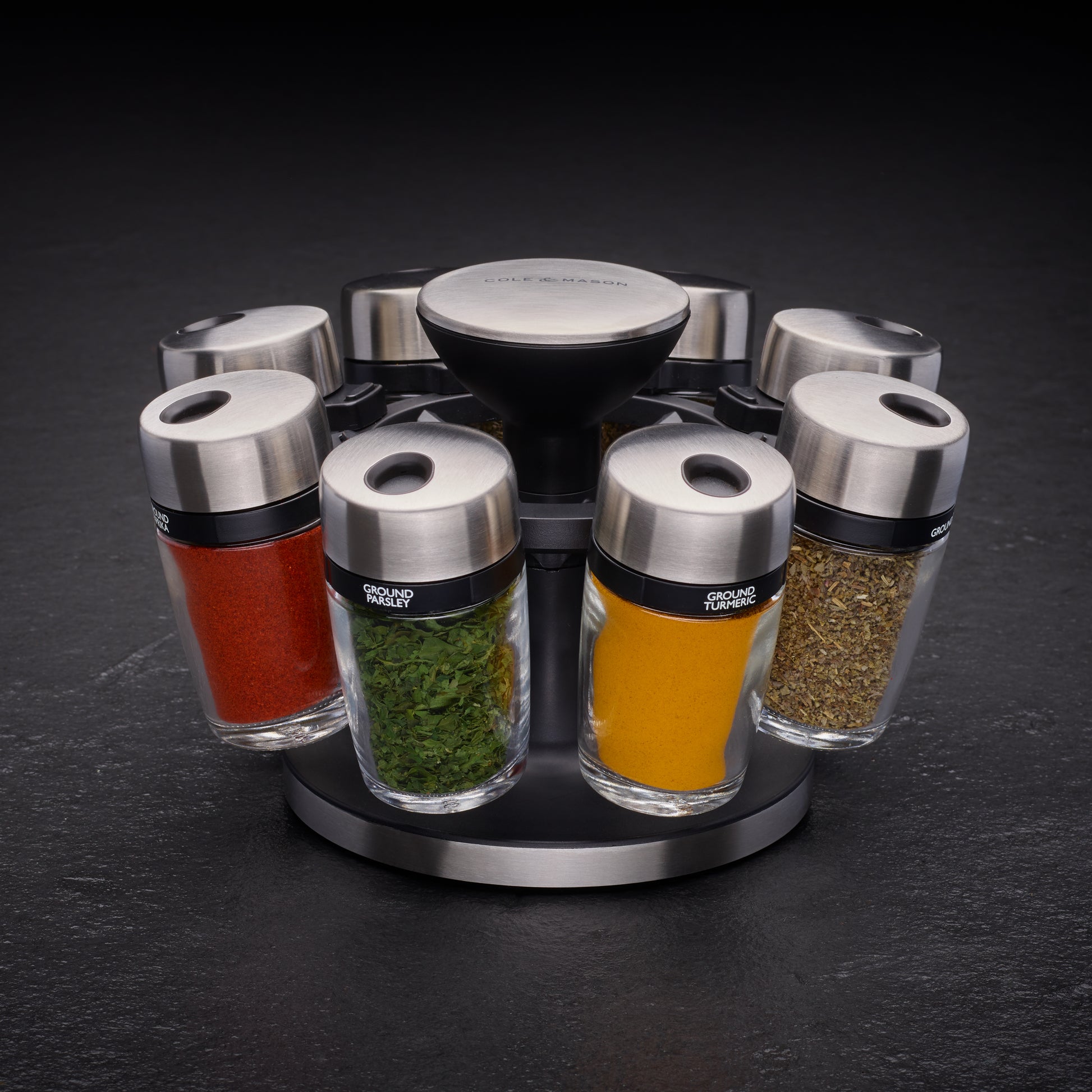Cole & Mason herb and spice carousel with 8 jars, featuring a rotating storage stand for kitchen spices and herbs.
