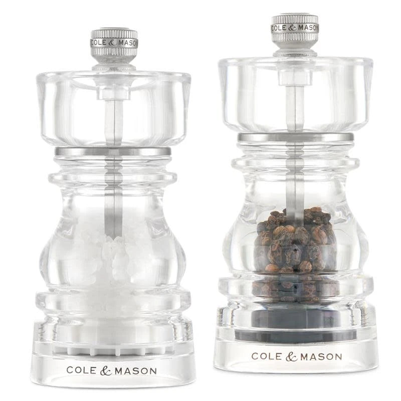 Cole & Mason London Mills acrylic salt and pepper shakers gift set, 13cm tall, clear acrylic with black and white seasoning caps.