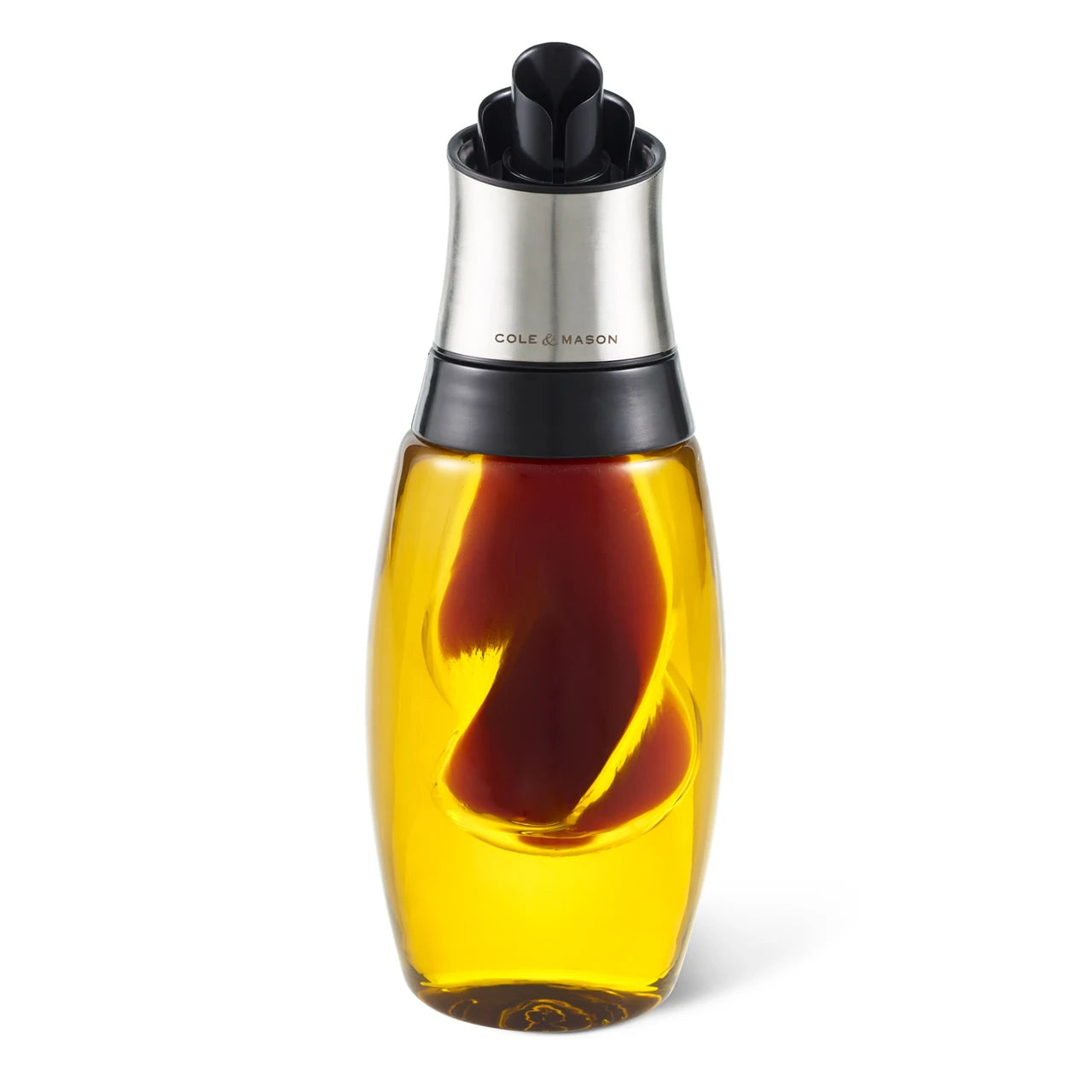 Cole & Mason Oil & Vinegar Duo Pourer paired with salt and pepper shakers on a kitchen countertop.