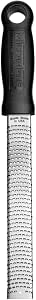 Microplane Premium Classic Zester in black, a handheld food grater with a fine stainless steel blade for zesting and grating citrus and spices.