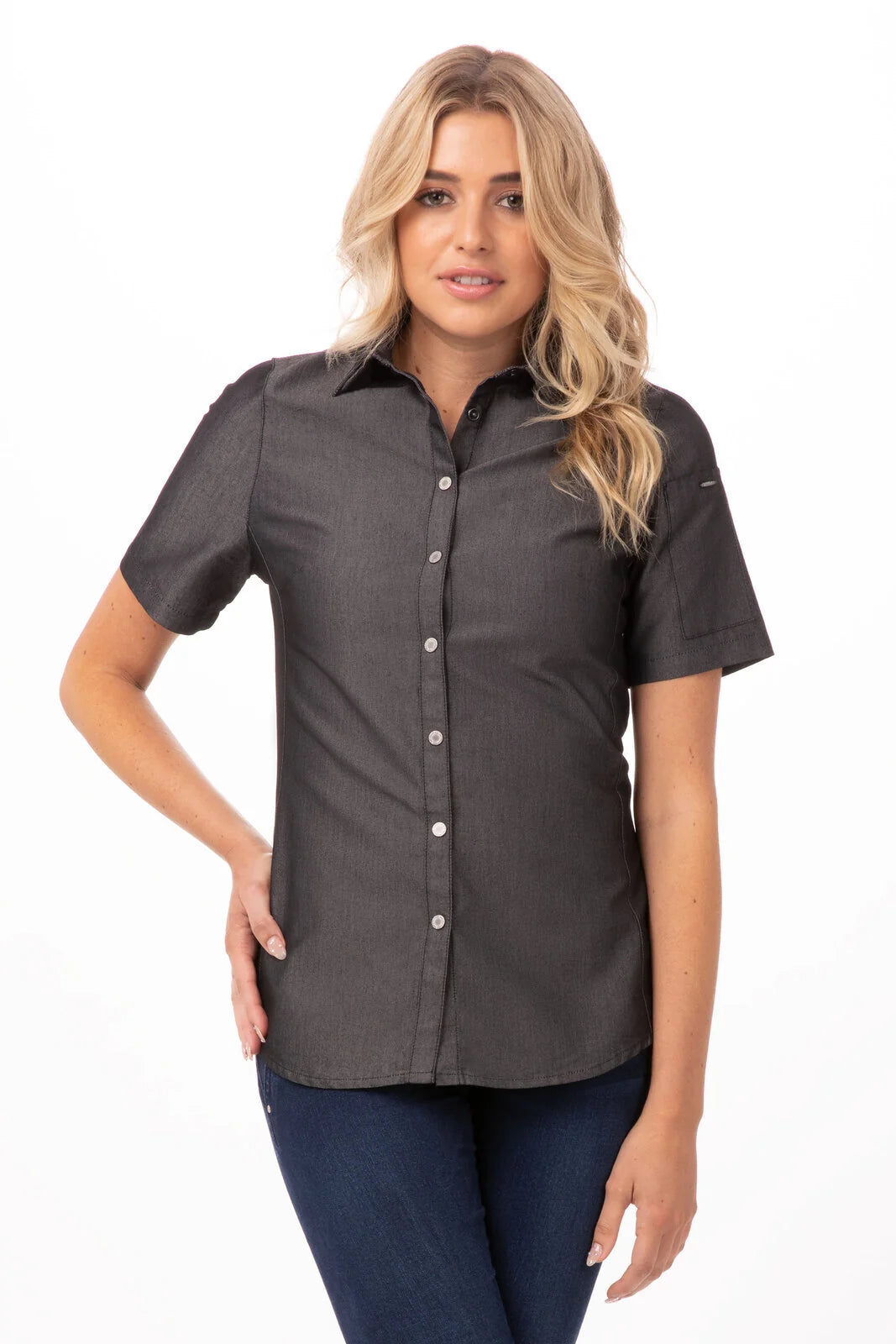 Chef Works Detroit women's denim shirt displayed on a model, featuring classic blue denim, button-down front, and long sleeves.