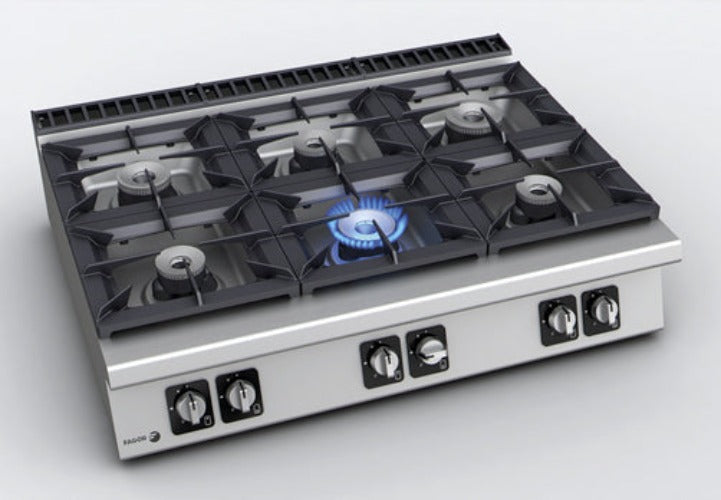 Fagor Kore 900 Series gas stove range with 6 burners and built-in oven, featuring stainless steel finish and control knobs.